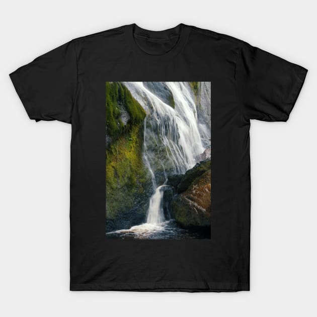 A beautiful waterfall cascades down a mountain in Ireland. T-Shirt by karinelizabeth